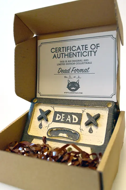 Dead Format - Toy Inside Packaging (Viewed From The Right)